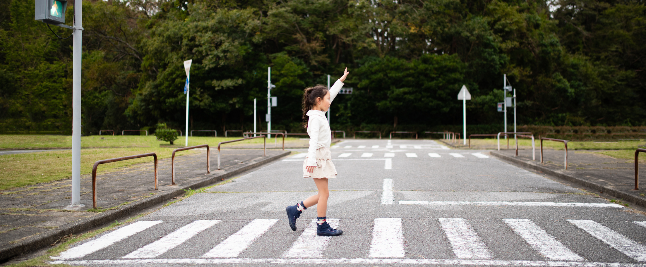 Child crossing the pedestrian crossing